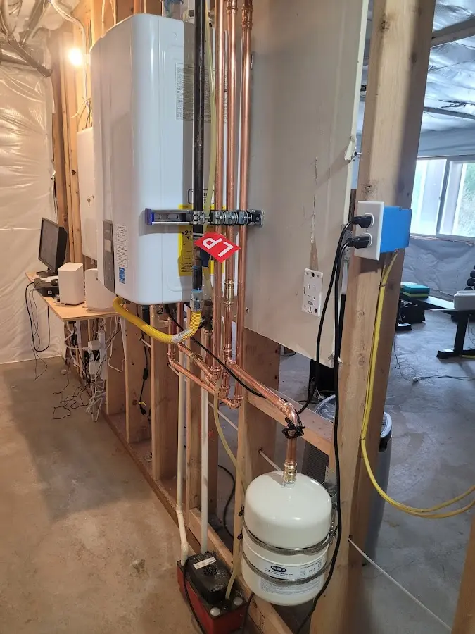 Licensed plumber repairing a kitchen sink in Houlton